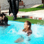 Cute champagne stealing hotties thrown in the pool